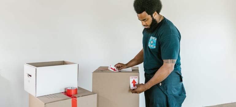a mover labelling a box