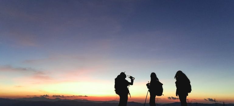 three people hiking