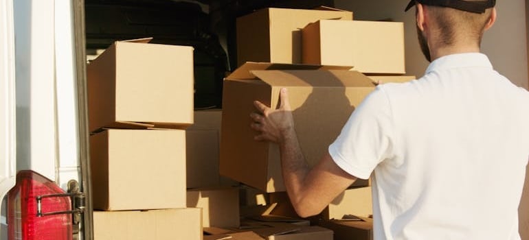 a man unloading boxes