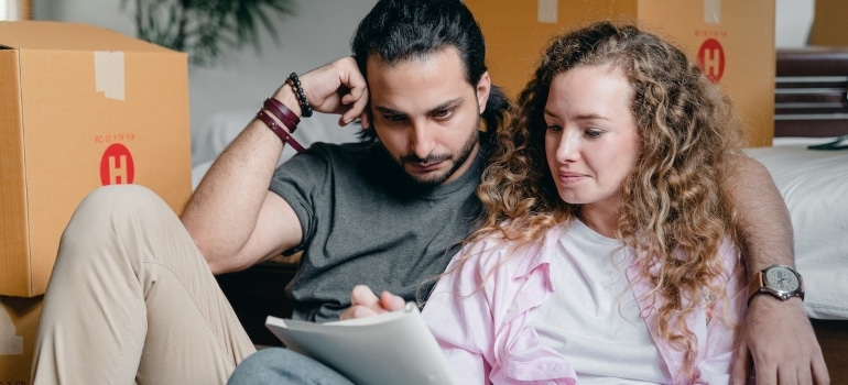 a couple calculating the cost of living after moving to Aspen