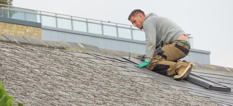 a man repairing the roof