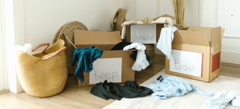boxes labelled ' keep,' 'sell,' donate' - the best way how to declutter your home fast
