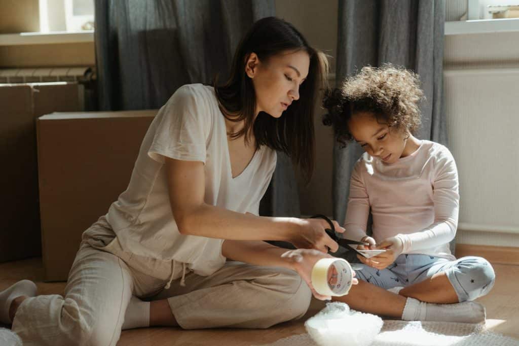 a woman and her child using bubble wrap