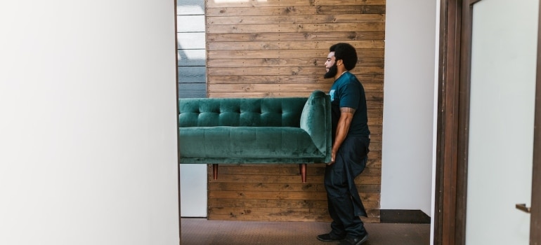 movers carrying a sofa